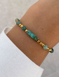 Bracelet on an elastic band with khaki cubic zirconia and natural pearl