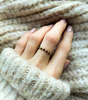 Elastic black spinel ring with gold-plated balls