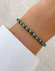 Bransoletka na gumce z malachitu z hematytem - obfitość,  optymizm, spokojny sen