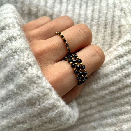 Elastic black spinel ring with gold-plated balls