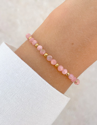 Bracelet on an elastic band with khaki cubic zirconia and natural pearl