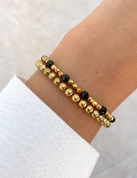Bracelet on an elastic band with khaki cubic zirconia and natural pearl