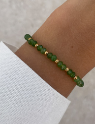 Bracelet on an elastic band with khaki cubic zirconia and natural pearl