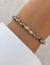 Bracelet on an elastic band with khaki cubic zirconia and natural pearl