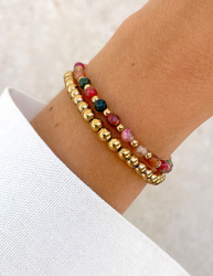 Bracelet on an elastic band with khaki cubic zirconia and natural pearl