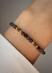 Bracelet on an elastic band with khaki cubic zirconia and natural pearl