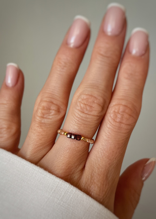 Pierścionek granat cyrkonia szampańska