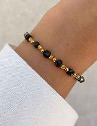 Bracelet on an elastic band with khaki cubic zirconia and natural pearl