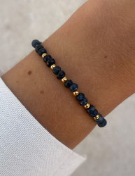 Bracelet on an elastic band with khaki cubic zirconia and natural pearl