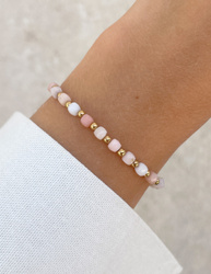Bracelet on an elastic band with khaki cubic zirconia and natural pearl