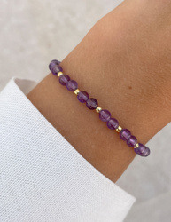 Bracelet on an elastic band with khaki cubic zirconia and natural pearl