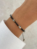 Bransoletka na nici z czarnym turmalinem z jaspisem dalmatyńskim - ochrona, odwaga, determinacja