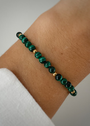 Bracelet on an elastic band with khaki cubic zirconia and natural pearl