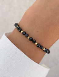 Bracelet on an elastic band with khaki cubic zirconia and natural pearl