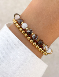 Bracelet on an elastic band with khaki cubic zirconia and natural pearl