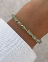 Bracelet on an elastic band with khaki cubic zirconia and natural pearl