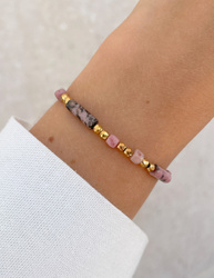 Bracelet on an elastic band with khaki cubic zirconia and natural pearl