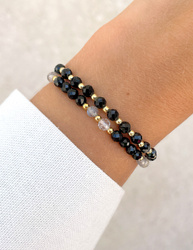 Bracelet on an elastic band with khaki cubic zirconia and natural pearl