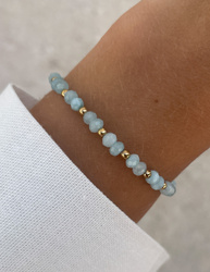 Bracelet on an elastic band with khaki cubic zirconia and natural pearl