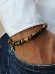 Bracelet on an elastic band with khaki cubic zirconia and natural pearl