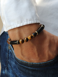 Bracelet on an elastic band with khaki cubic zirconia and natural pearl
