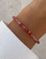 Bracelet on an elastic band with khaki cubic zirconia and natural pearl