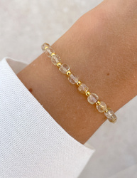 Bracelet on an elastic band with khaki cubic zirconia and natural pearl