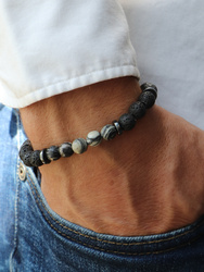 Bracelet on an elastic band with khaki cubic zirconia and natural pearl
