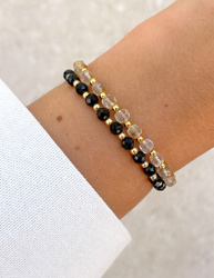 Bracelet on an elastic band with khaki cubic zirconia and natural pearl