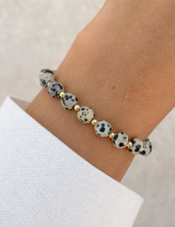 Bracelet on an elastic band with khaki cubic zirconia and natural pearl