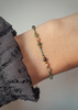 Bracelet natural stones zoisite with ruby ​​zircon, champagne, silk thread