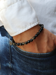 Bracelet on an elastic band with khaki cubic zirconia and natural pearl