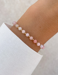 Bracelet on an elastic band with khaki cubic zirconia and natural pearl