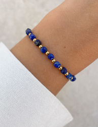 Bracelet on an elastic band with khaki cubic zirconia and natural pearl