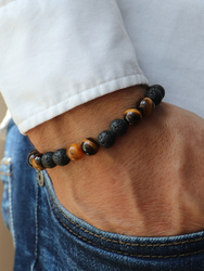 Bracelet on an elastic band with khaki cubic zirconia and natural pearl