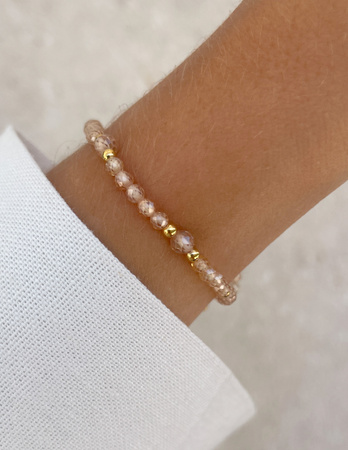 Bransoletka na gumce z cyrkonii szampańskiej z hematytem - ochrona, miłość, dostatek