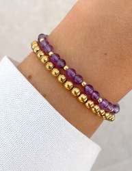 Bracelet on an elastic band with khaki cubic zirconia and natural pearl