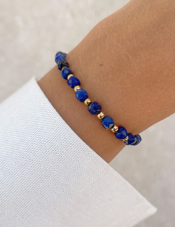 Bransoletka na gumce z lapis lazuli z hematytem - szczęście, dobrobyt, mądrość i odwaga