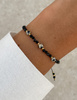 Bransoletka na nici z czarnym turmalinem z jaspisem dalmatyńskim - ochrona, odwaga, determinacja