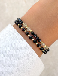 Bracelet on an elastic band with khaki cubic zirconia and natural pearl