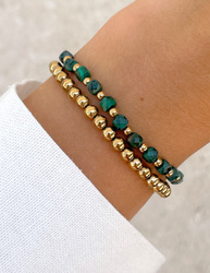 Bracelet on an elastic band with khaki cubic zirconia and natural pearl