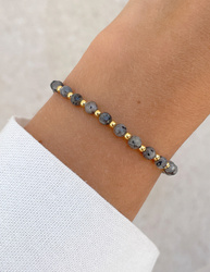 Bracelet on an elastic band with khaki cubic zirconia and natural pearl