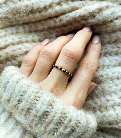 Elastic black spinel ring with gold-plated balls
