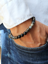 Bracelet on an elastic band with khaki cubic zirconia and natural pearl