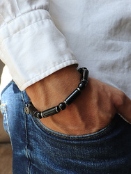 Bracelet on an elastic band with khaki cubic zirconia and natural pearl