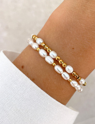 Bracelet on an elastic band with khaki cubic zirconia and natural pearl