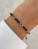 Bransoletka na nici z czarnym turmalinem z jaspisem dalmatyńskim - ochrona, odwaga, determinacja