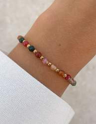 Bracelet on an elastic band with khaki cubic zirconia and natural pearl