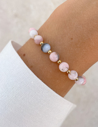 Bracelet on an elastic band with khaki cubic zirconia and natural pearl