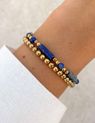 Bracelet on an elastic band with khaki cubic zirconia and natural pearl